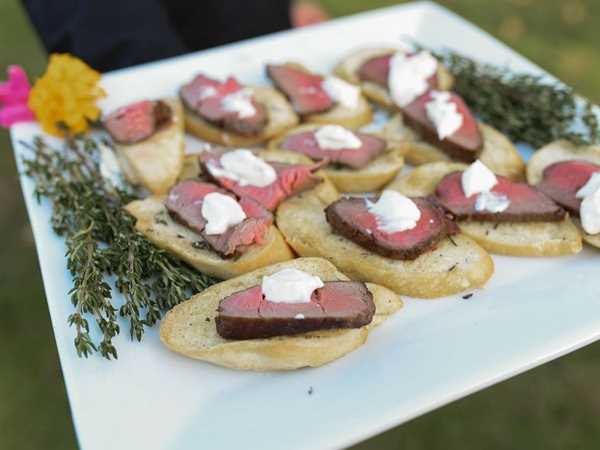 beef tenderloin appetizers on a catering tray